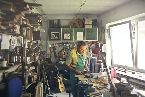 man with glasses working in hobby room