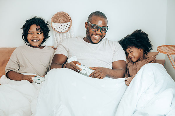 black father at home with kids