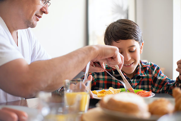 father and son at the the kitchen table